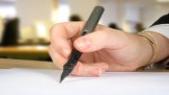 photo of person writing a letter